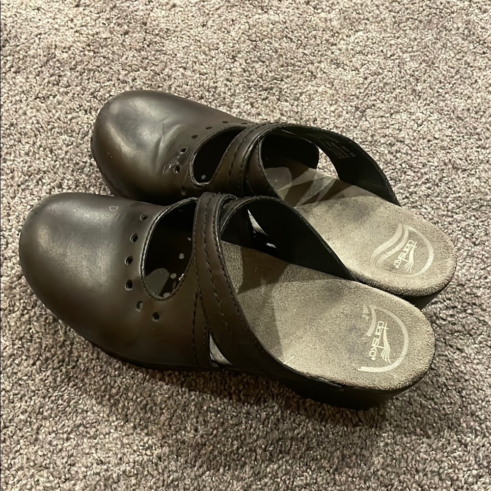 Dansko woman’s Black Mules Classic Slip-On Design